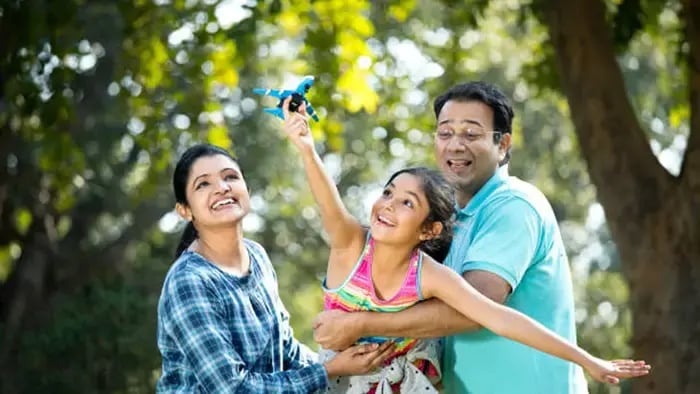 Indian kids playing with parents