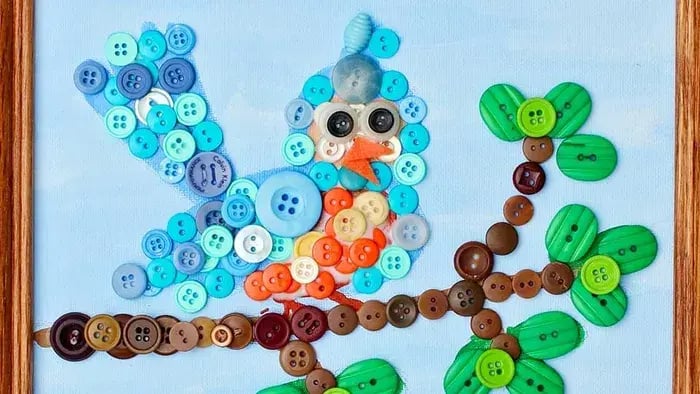 Sparrow made of buttons sitting on a branch