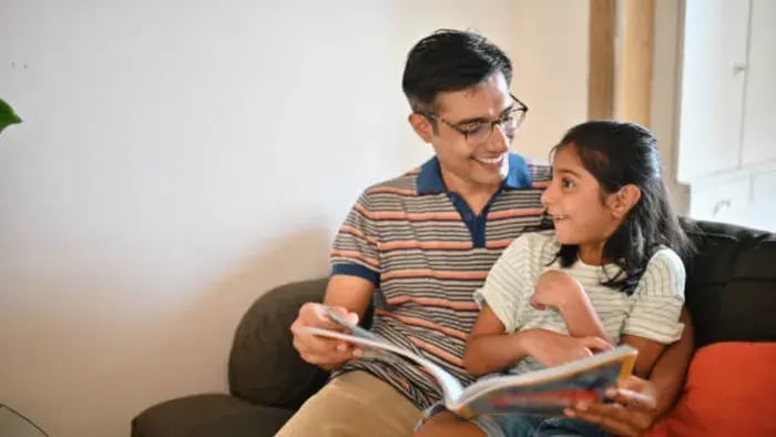 Indian kids and parents reading