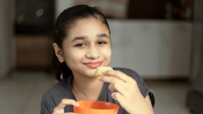Indian Kids Eating Snacks