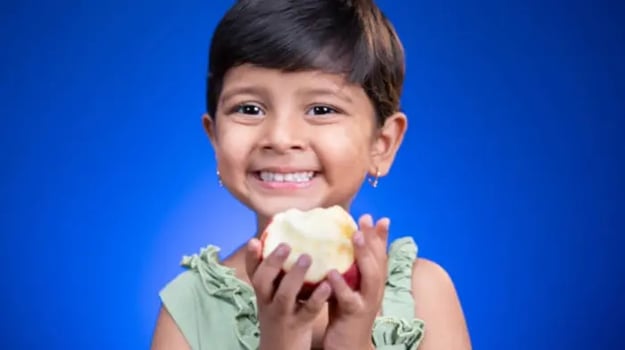 Indian kids enjoying fruits