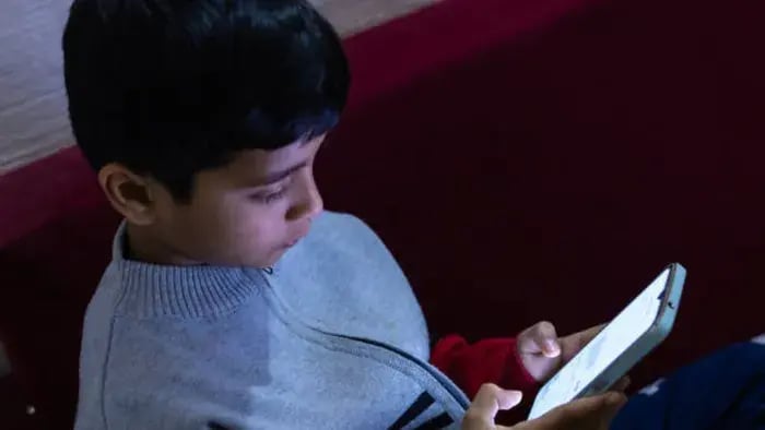 Indian kids on phone