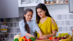 Indian Kid And Parents Cooking