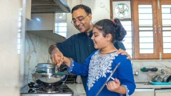 Indian Kid And Parents Cooking