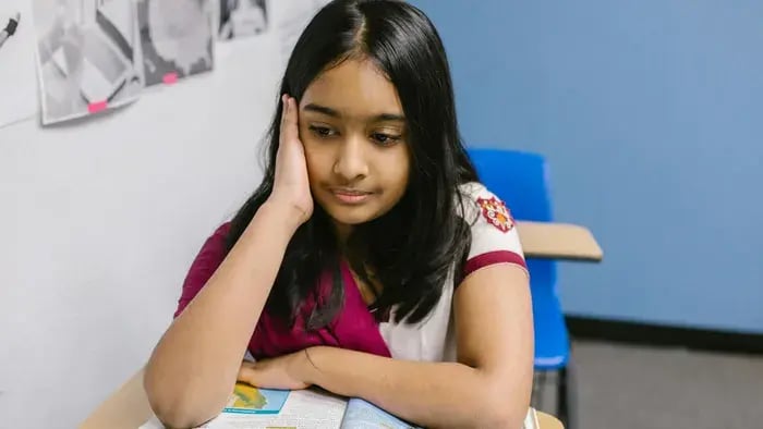 Girl Reading From A Book