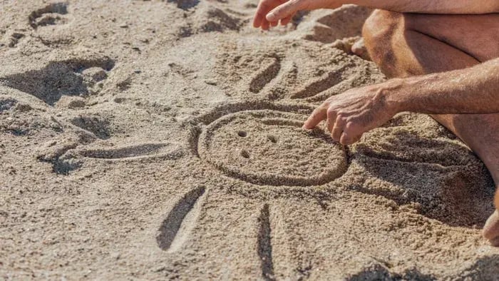 sun drawn in the sand