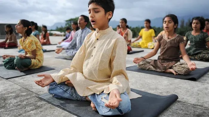 mother helping the kid with meditation