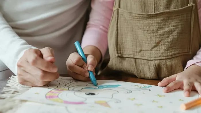 Girl Drawing On Paper