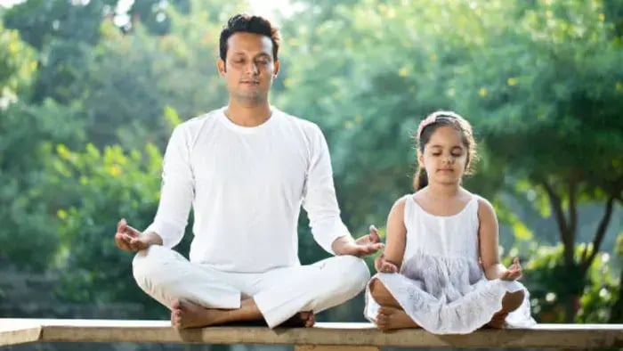 7 Easy Yoga Poses for Kids: Fun and Simple Ways to Stay Fit - Father and kid doing yoga in a garden