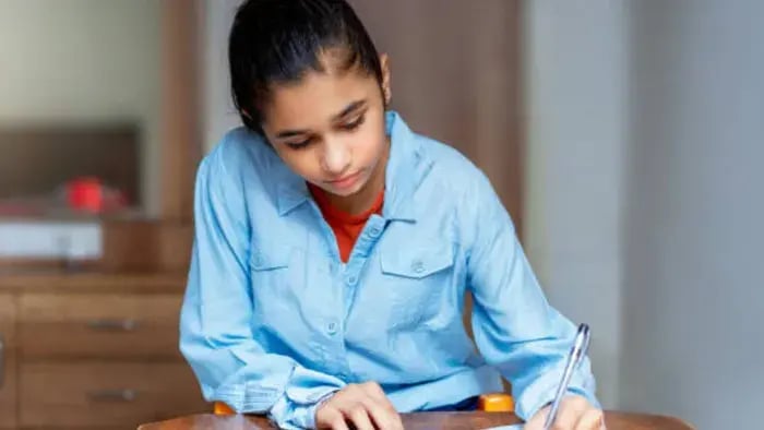7 Effective Ways to Quiet a Busy Mind for Students - Indian kids writing