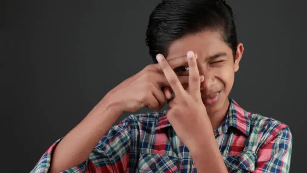 Indian kid doing eye exercises