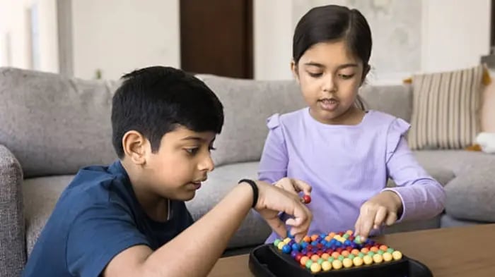 Indian Kid Playing Puzzle