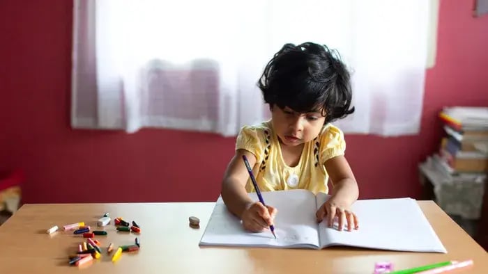 Kid drawing with colors