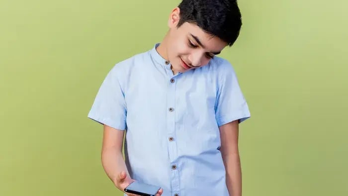 Kid looking at his phone