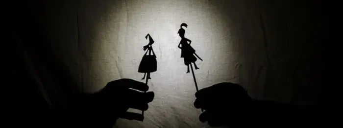Shadows of puppets on a wall