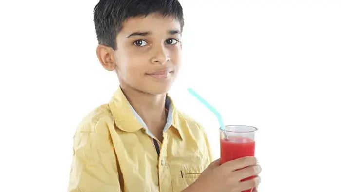 Indian Kid Drinking Juice