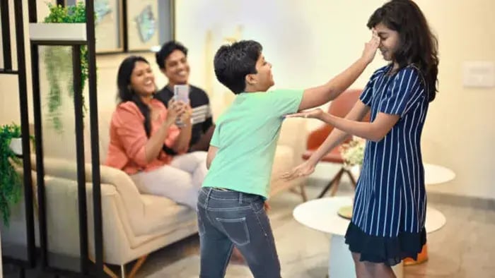 Indian Kid Playing With Parents