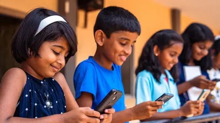 Kid Using Phones While Sitting Together