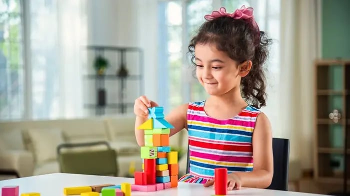 girl playing with blocks