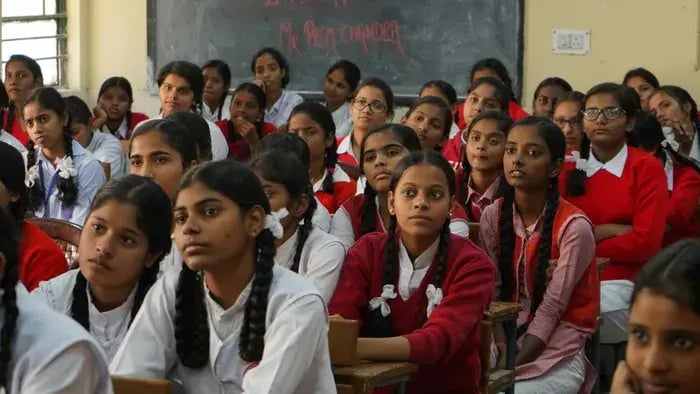 7 Reasons Why Students Should Wear Uniforms: Lessons in Equality and Discipline - Girls studying in a classroom