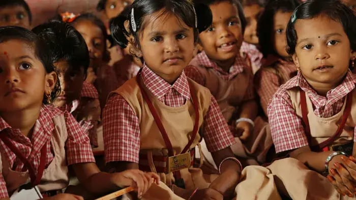 7 Reasons Why Students Should Wear Uniforms: Lessons in Equality and Discipline - Kids wearing uniform sitting together