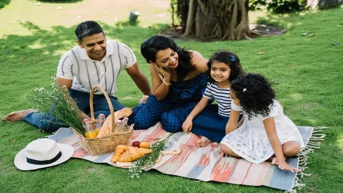 Family on a picnic in a garden