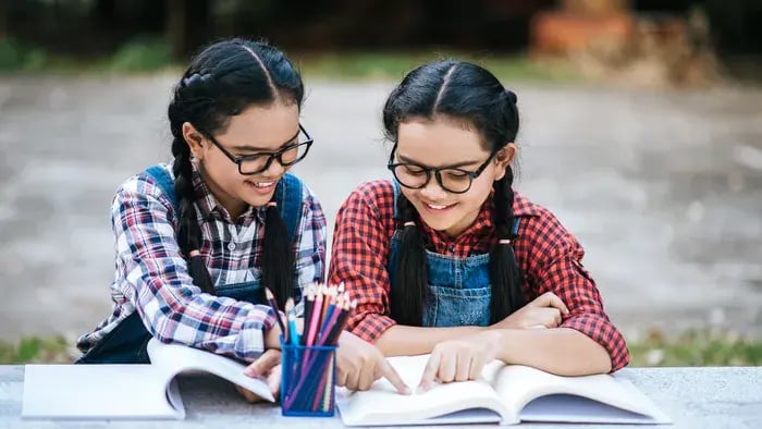 kids studying on a desk