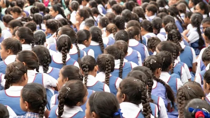 students stading in assembly