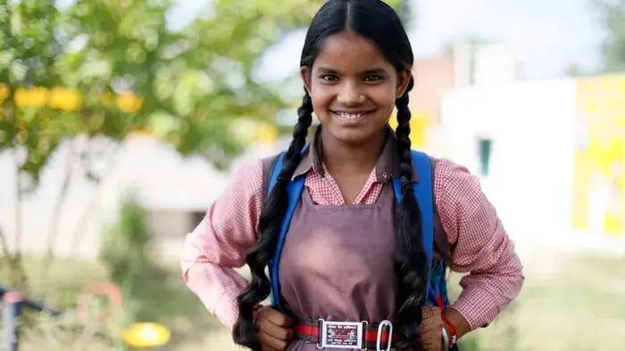Girl smiling in school uniform