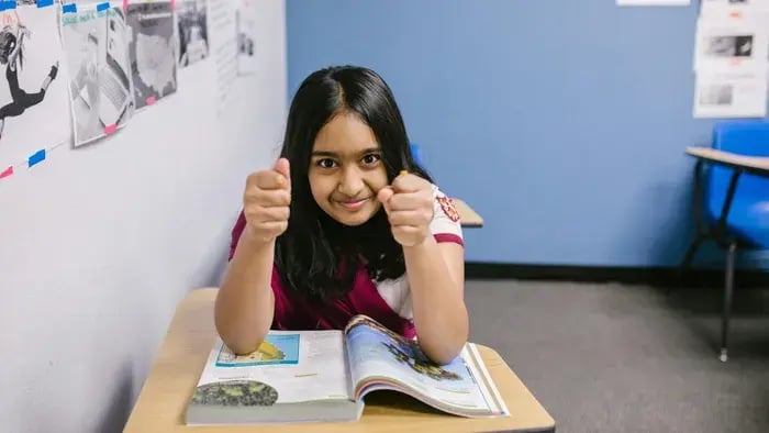 girl smiling while studying