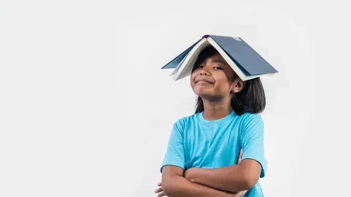 girl with a book on her head