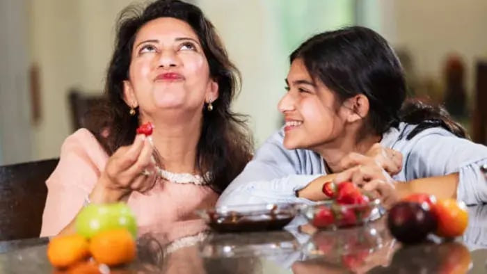 Indian kids eating fruits