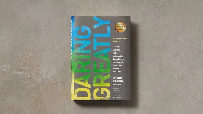 grey book cover with daring greatly written vertically