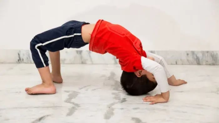 Indian Kid Doing Floor Exercises