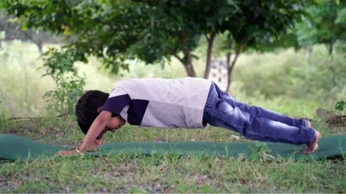 Indian Kid Doing Floor Exercises