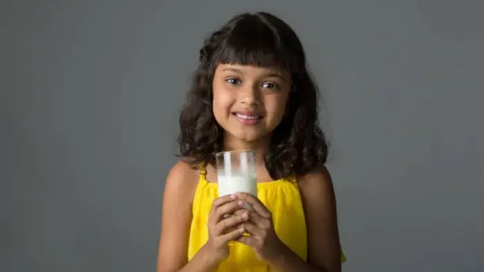 Indian kid drinking milk