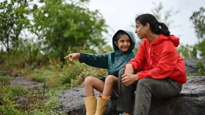 Indian kid hiking with parents