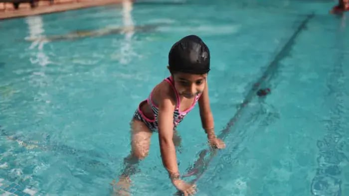 Indian kid doing swimming