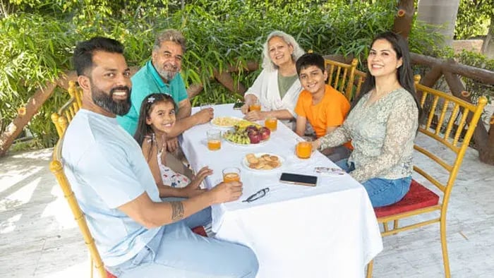 Indian Kid And Parents Eating