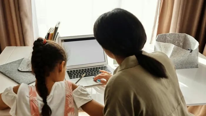 Kid Studying On A Laptop
