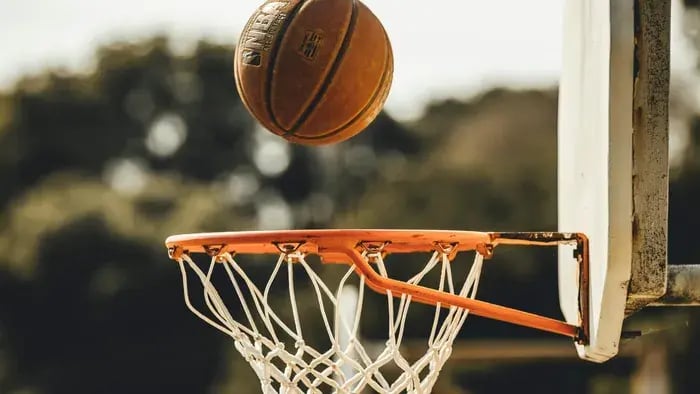 Ball in a basketball net