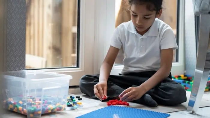 Kid Playing Lego Toys For Cognitive Development