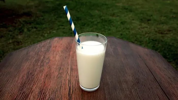 milk glass with a straw