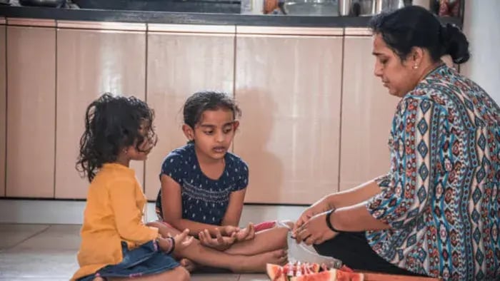 Indian Kids eating watermelon
