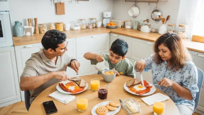 Indian kid and parents having food