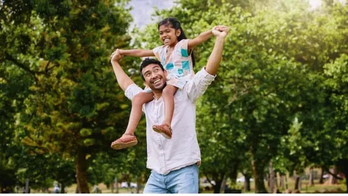 Indian kid playing with parents