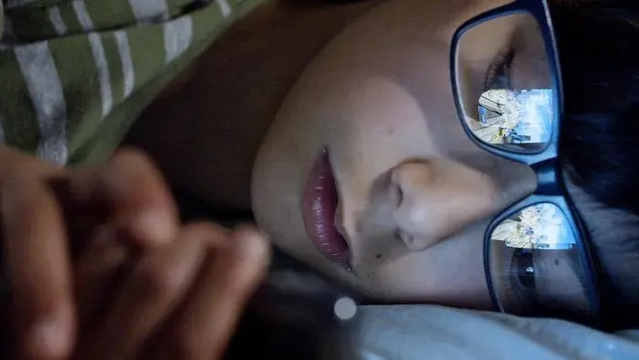 Kid Using Phone With While Laying Down