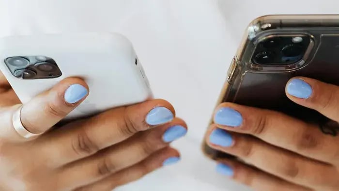 Two Phones In Hand