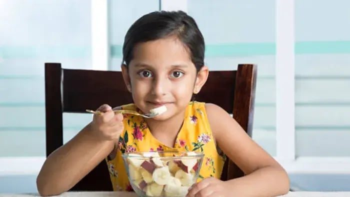 Indian kid having food