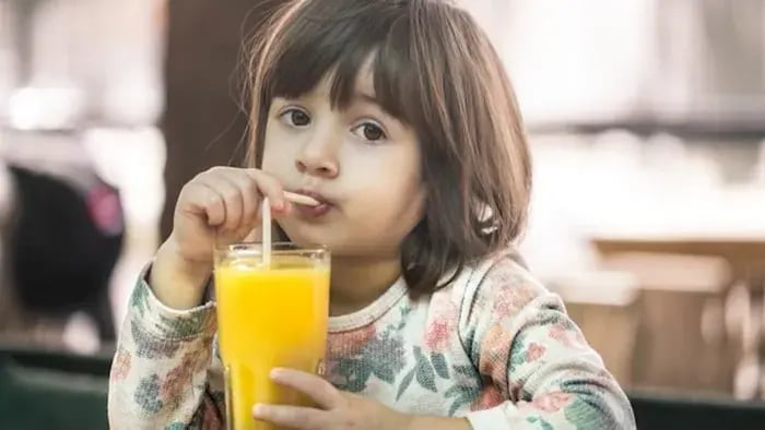 Indian Kid Drinking Juice